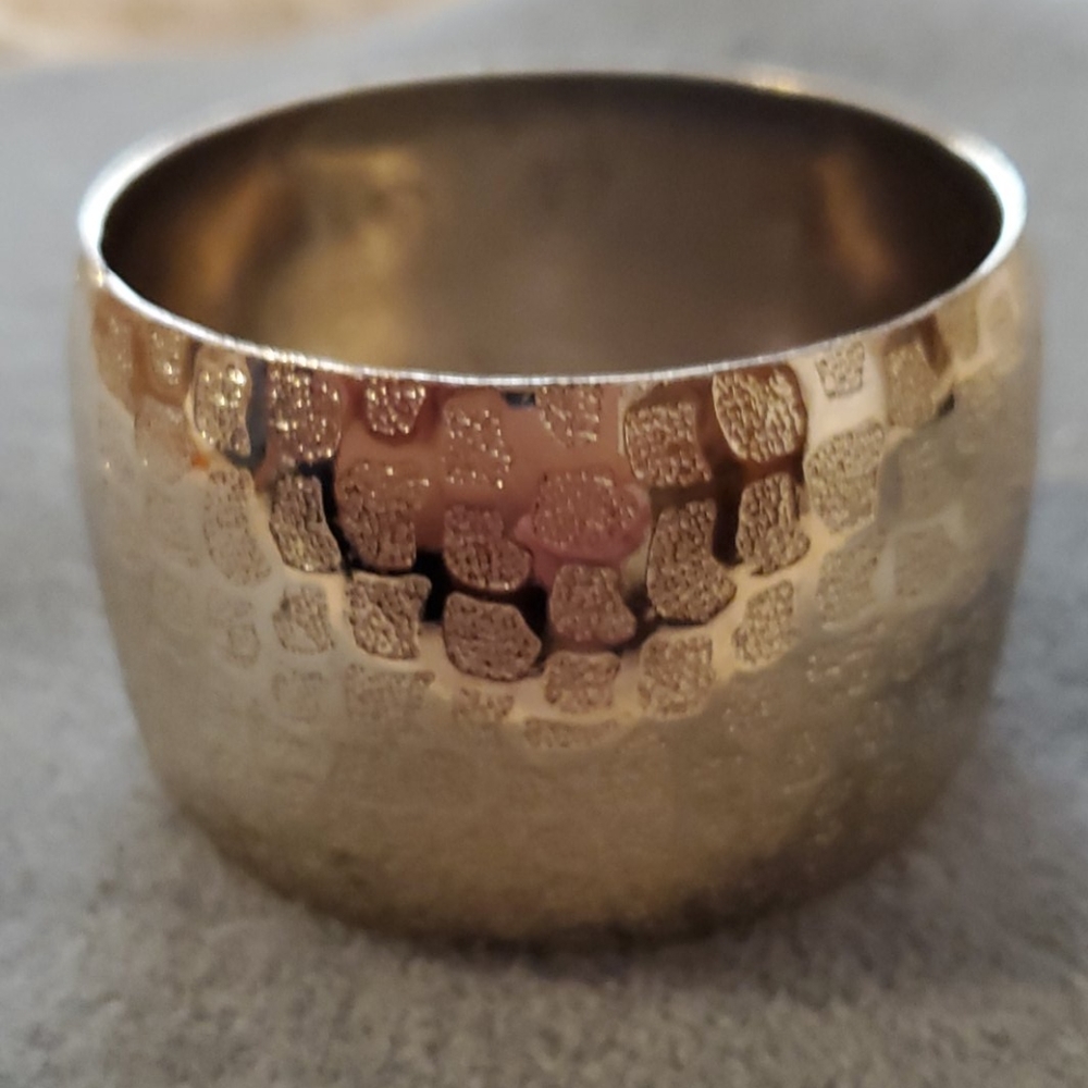 Express goldtone wide bangle.